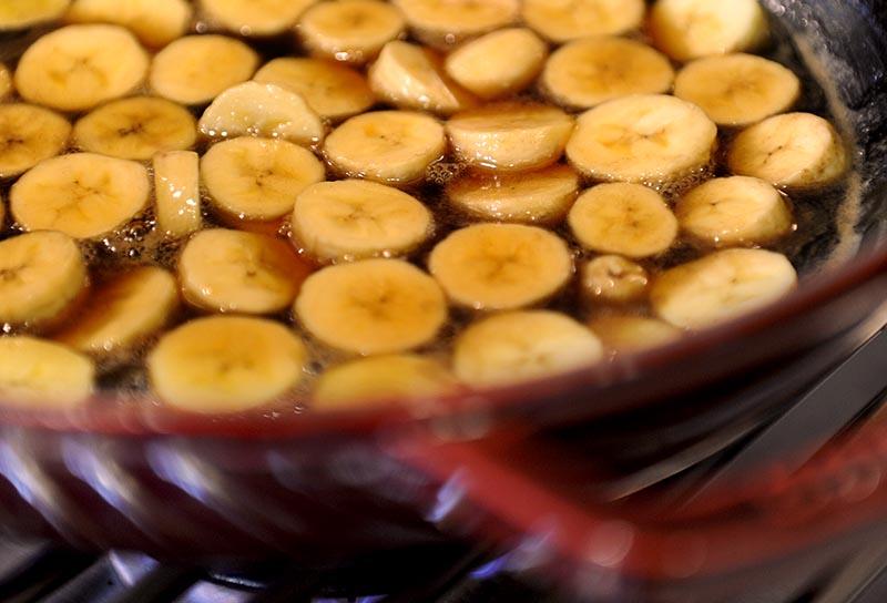 Brandied bananas simmering on a Kalamazoo cooktop burner