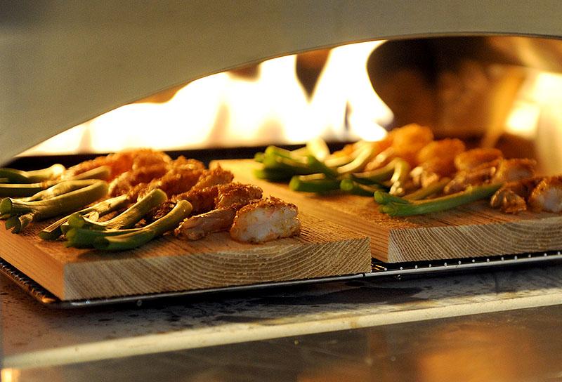 Shrimp roasting in the pizza oven