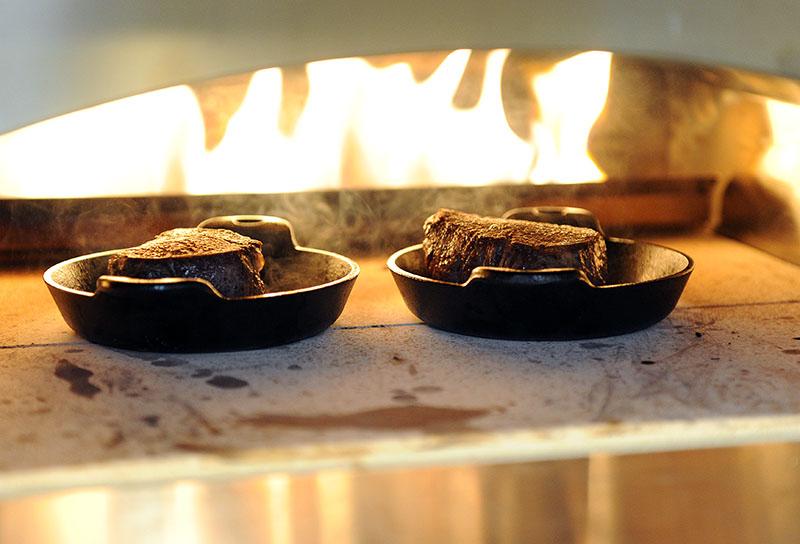 Tenderloin steaks roasting in the pizza oven