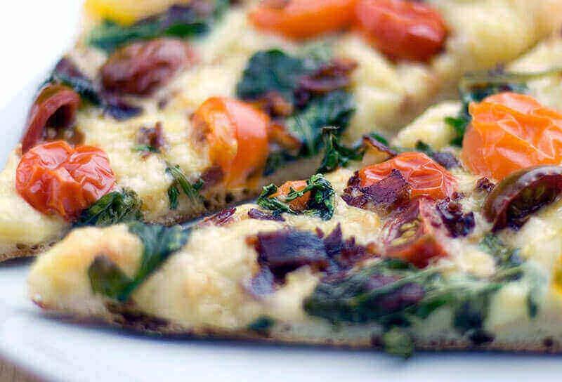 Image of Rustic Pizza with Baby Arugula, Pancetta and Tomatoes
