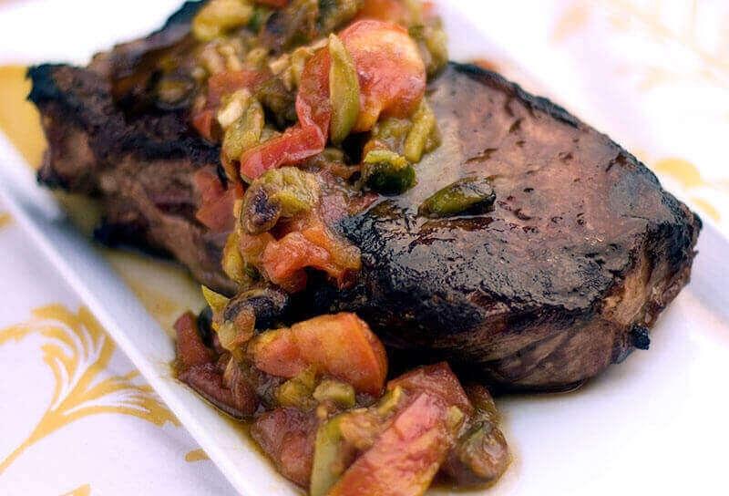 Image of Steak with Roasted Tomatoes, Olives and Pistachios