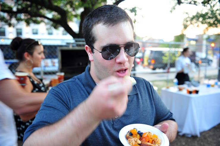 Spencer Flynn loving the food from Frontera Grill at Green City Market