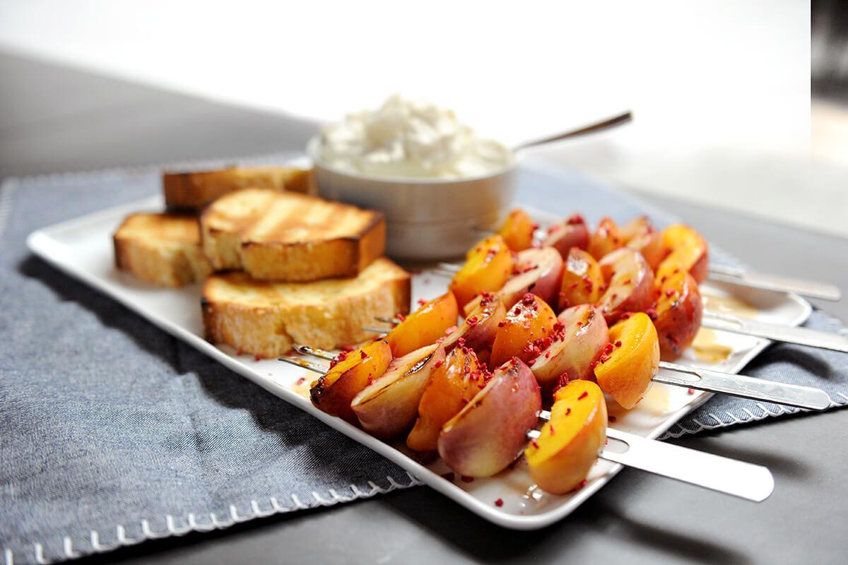 Image of Grilled Fruit Kebabs with Maple Glaze and Bourbon-spiked Whipped Cream