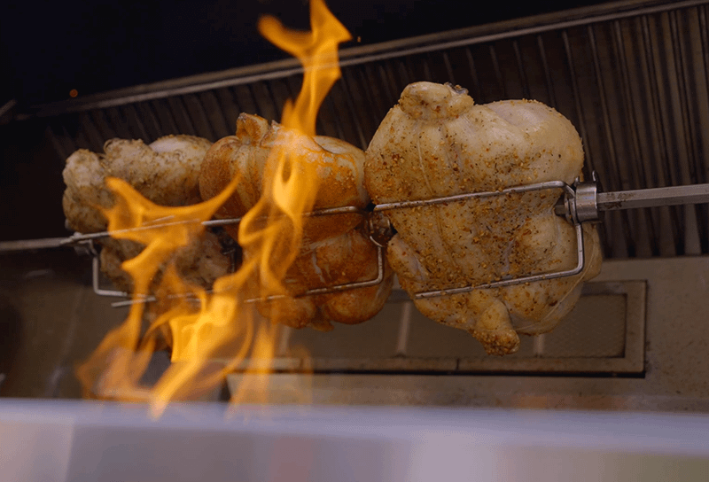 chicken roasting on a rotissire 