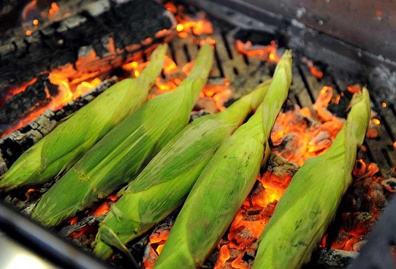 corn resting on hot charcoal 