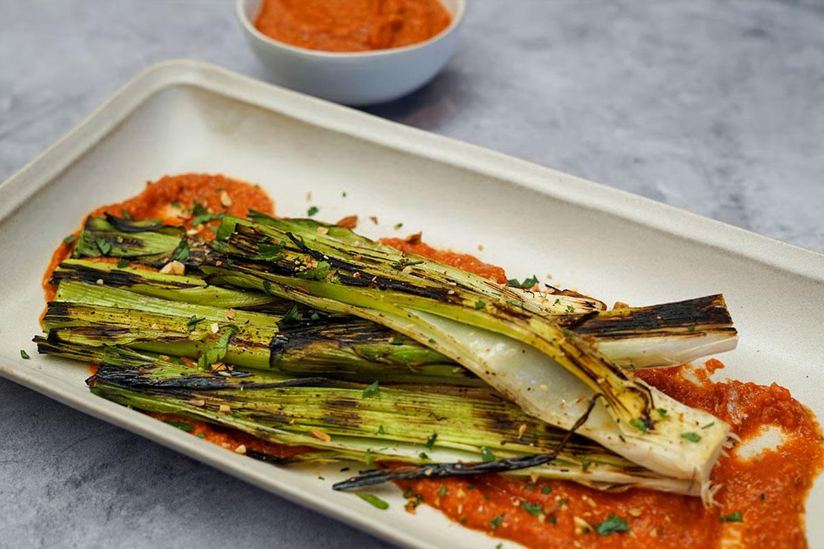 Image of Grilled Leeks with Fire Roasted Romesco Sauce